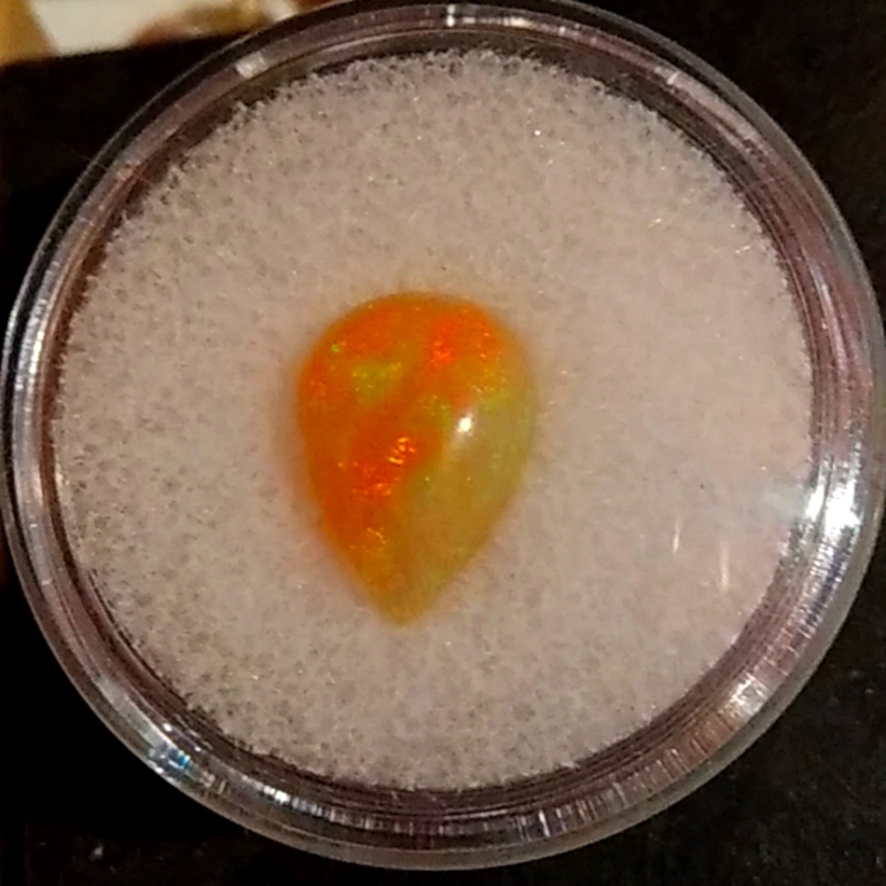 Fire Opal with lots of green and reds, a beautiful 2.45ct gem.